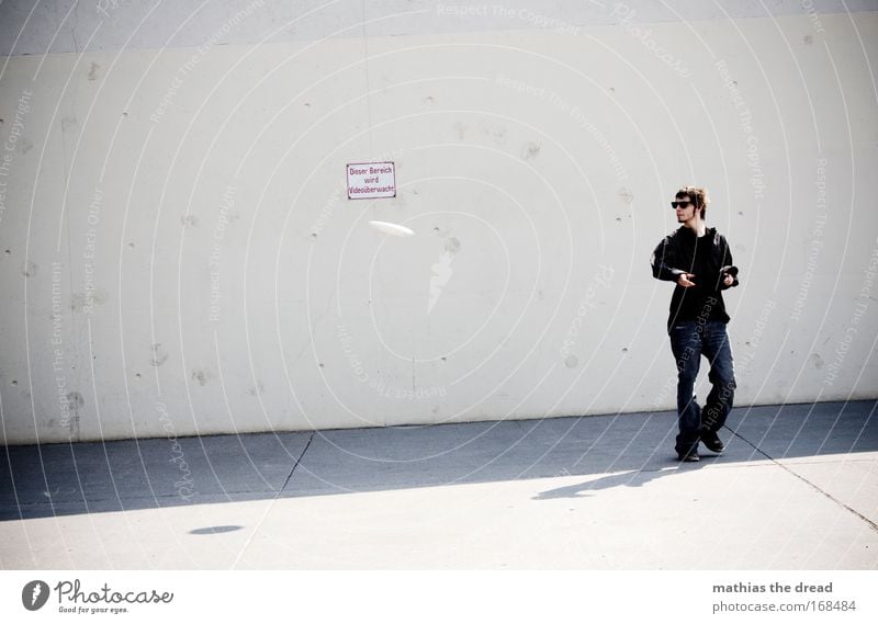 DISC LATHE Colour photo Subdued colour Exterior shot Neutral Background Day Shadow Contrast Sunlight Motion blur Shallow depth of field Full-length Looking away