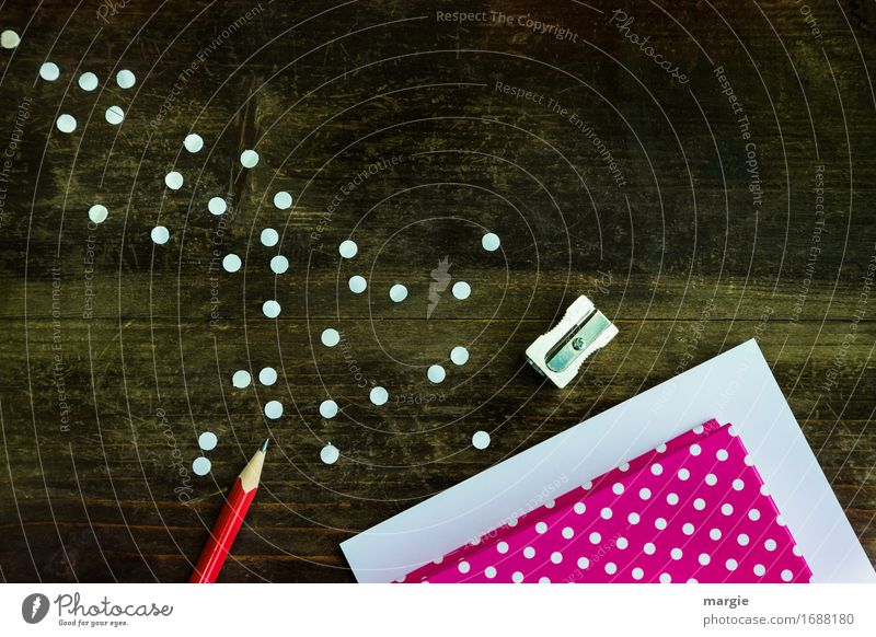 Collect points: red paper and white points with red pencil and sharpener on a wooden table Education School Study Profession Office work Workplace