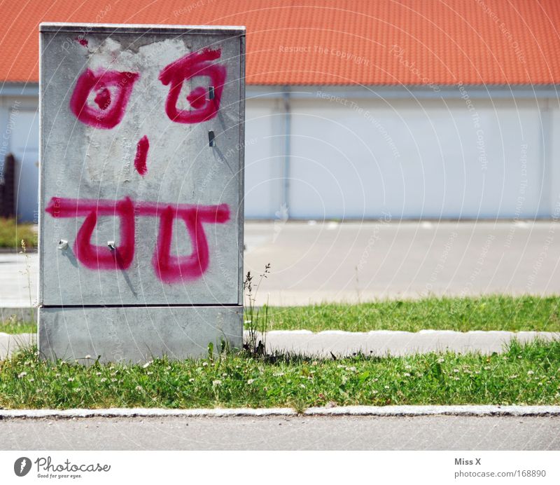 Strombob metal head Colour photo Exterior shot Street Graffiti Threat Funny Bizarre Electricity energy guzzlers Power consumption Electrical circuit power box