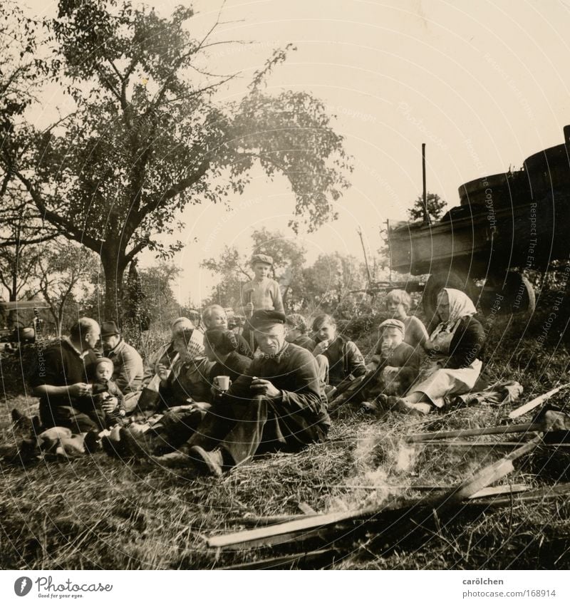 Worker break (vintage 1950) Black & white photo Subdued colour Eating Team Human being Family & Relations Group Meadow Hill Work and employment Relaxation