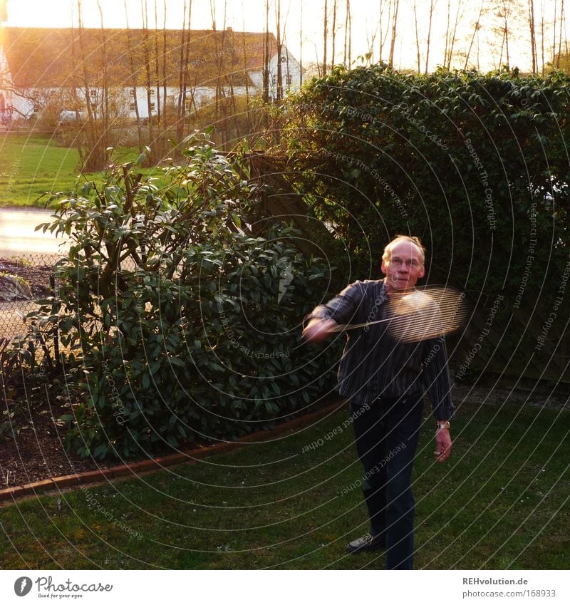 retiree garden sport Colour photo Exterior shot Copy Space left Twilight Back-light Motion blur Full-length Leisure and hobbies Playing Garden Ball sports