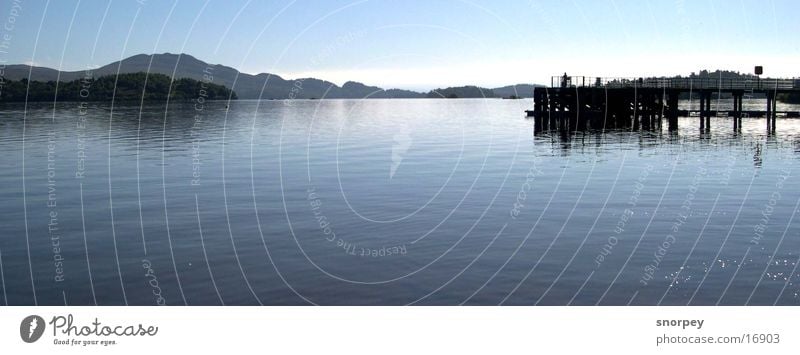 the lake Lake Deep Dark Undulating Body of water Europe Great Britain Scotland Loch Lomond Glasgow Footbridge Wood Panorama (View) Calm Serene Contentment Blue