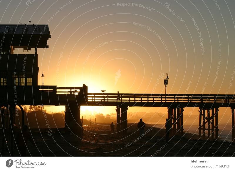 Sunrise Pier Ventura Colour photo Subdued colour Exterior shot Morning Dawn Evening Twilight Silhouette Sunlight Sunbeam Sunset Nature Elements Sand Water Sky