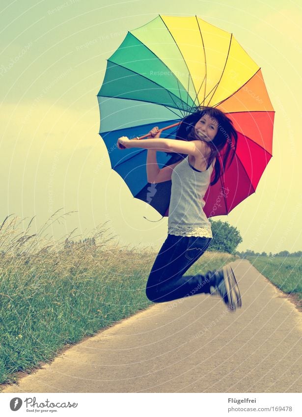 Jump into summer Feminine Young woman Youth (Young adults) 1 Human being 18 - 30 years Adults Beautiful weather Field umbrella Prismatic colors Lanes & trails