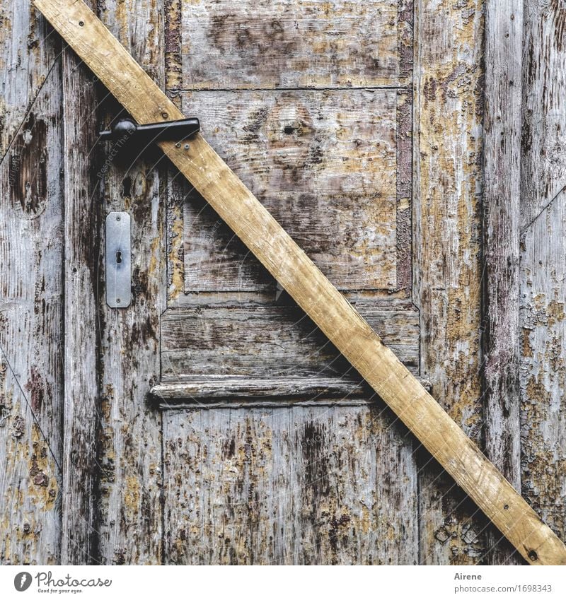 Hopeless Door Door lock Keyhole Door handle Wooden board Joist Tilt Creepy Brown Closed Absolute Colour photo Subdued colour Exterior shot Deserted