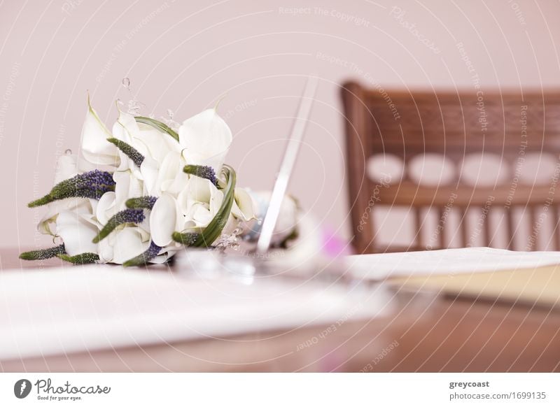 Low angle view of a pretty wedding bouquet of white flowers lying on a table top with selective focus and copyspace Luxury Elegant Happy Beautiful Decoration