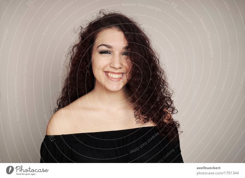 smiling teenage girl with curly hair Joy Human being Feminine Girl Young woman Youth (Young adults) Woman Adults 1 13 - 18 years Brunette Long-haired Curl