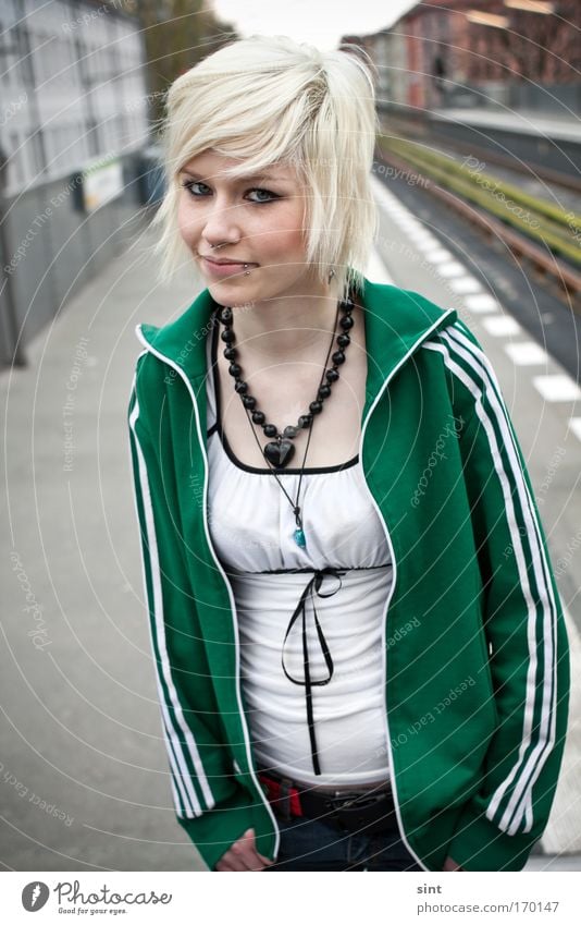 on track 1 Colour photo Exterior shot Close-up Day Shallow depth of field Portrait photograph Upper body Front view Looking into the camera Lifestyle