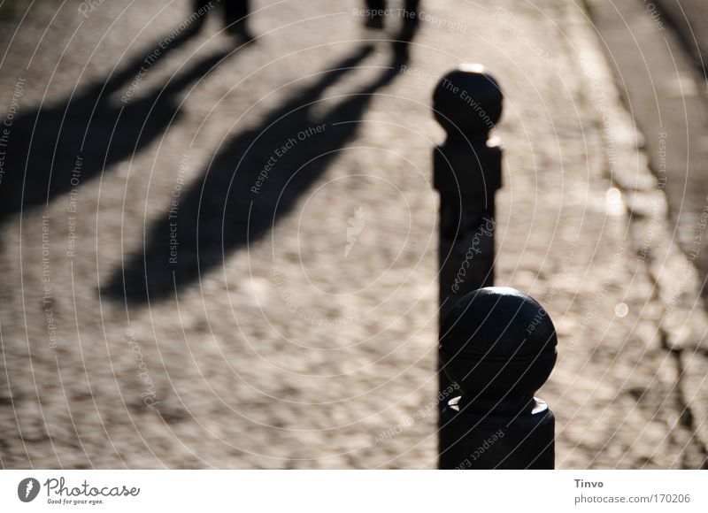 two that go - and two that stay Colour photo Subdued colour Exterior shot Copy Space bottom Evening Shadow Contrast Back-light Blur Old town Pedestrian