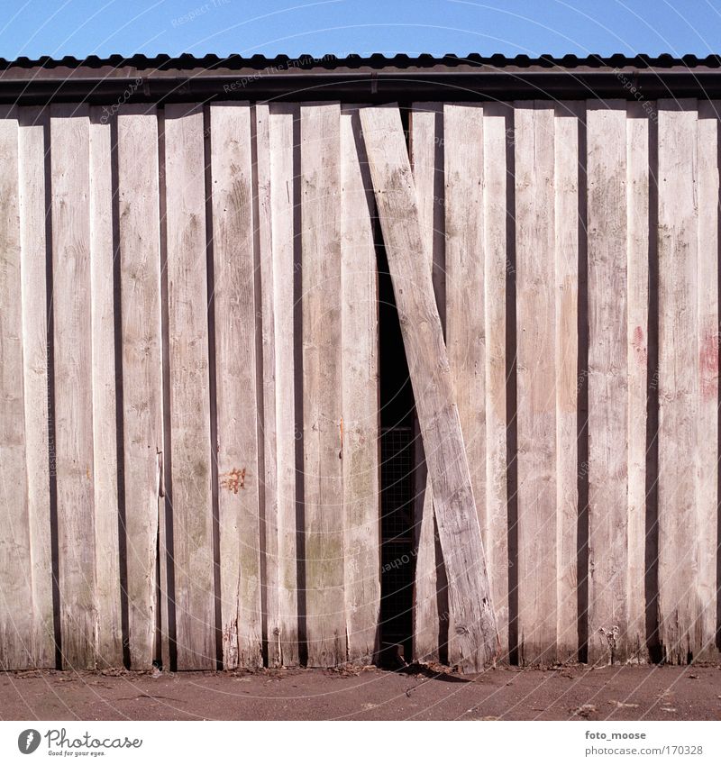 One Out Of Place Colour photo Exterior shot Deserted Day Shadow Central perspective Home improvement Redecorate Parking garage Manmade structures Building