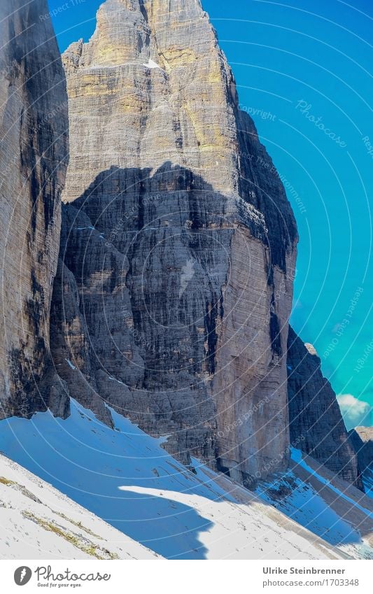 In the shadow of the Great Peak Mountain Hiking Environment Nature Landscape Sky Summer Beautiful weather Snow Rock Alps Dolomites Three peaks Italy Sharp-edged