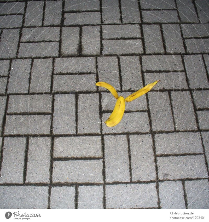 the way and the banana peel Colour photo Flash photo Banana Lanes & trails Stone Lie Throw Orderliness Cleanliness Dangerous Fear Environment Accident Slip