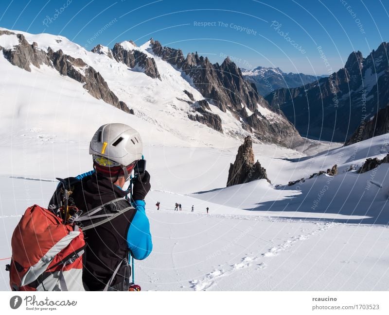 Mountaineer taking picture with a camera. Mont Blanc Glacier Lifestyle Vacation & Travel Tourism Adventure Expedition Snow Hiking Sports Climbing Mountaineering