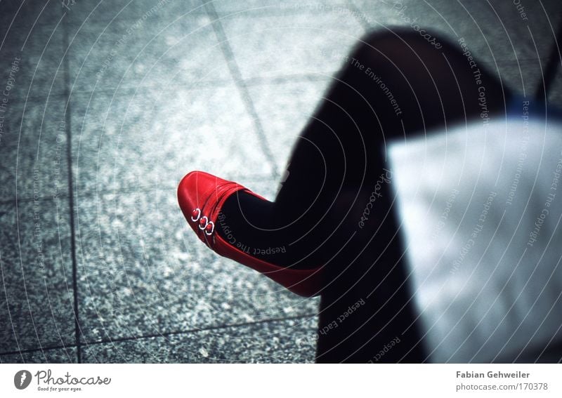 red hot II Colour photo Interior shot Detail Artificial light Shallow depth of field Human being Feminine Partner Legs Feet 1 Public transit Train station Sit