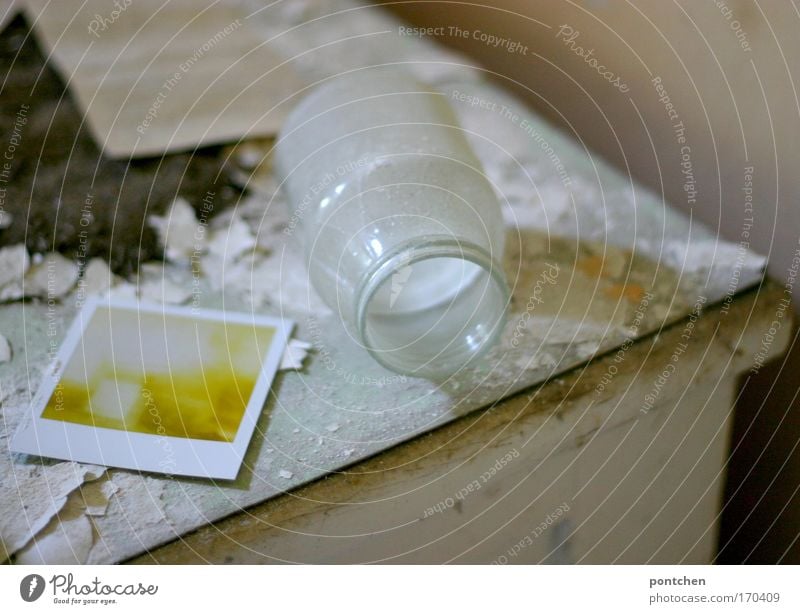 Chaos, decay. Glass jar and polaroidphoto are on an old, broken dresser. Dirt and grime. Lost place Colour photo Interior shot Day wood Old Dirty Uniqueness