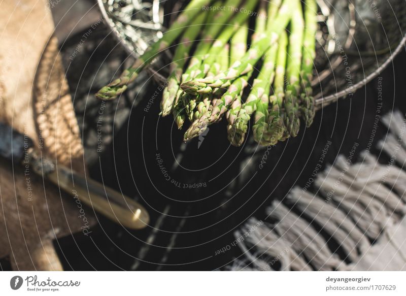 Asparagus on vintage table. Vegetable Nutrition Vegetarian diet Diet Table Kitchen Wood Dark Fresh Delicious Green background Organic cooking food healthy Raw