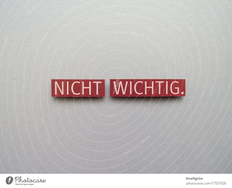 NOT IMPORTANT. Characters Signs and labeling Communicate Sharp-edged Gray Red White Emotions Serene Indifference Colour photo Studio shot Deserted