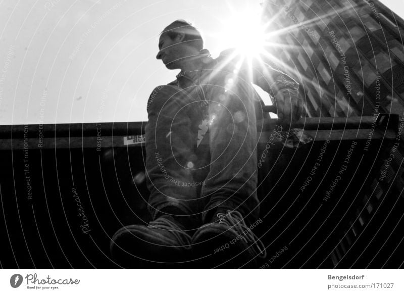 Meet me in the sun Black & white photo Exterior shot Sunlight Sunbeam Back-light Worm's-eye view Full-length Masculine 1 Human being Town High-rise Facade