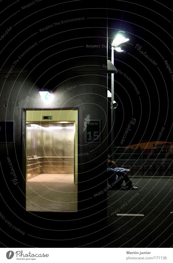 waiting Colour photo Subdued colour Exterior shot Close-up Copy Space top Night Light Looking away Lamp Night life Unemployment Elevator Human being Masculine