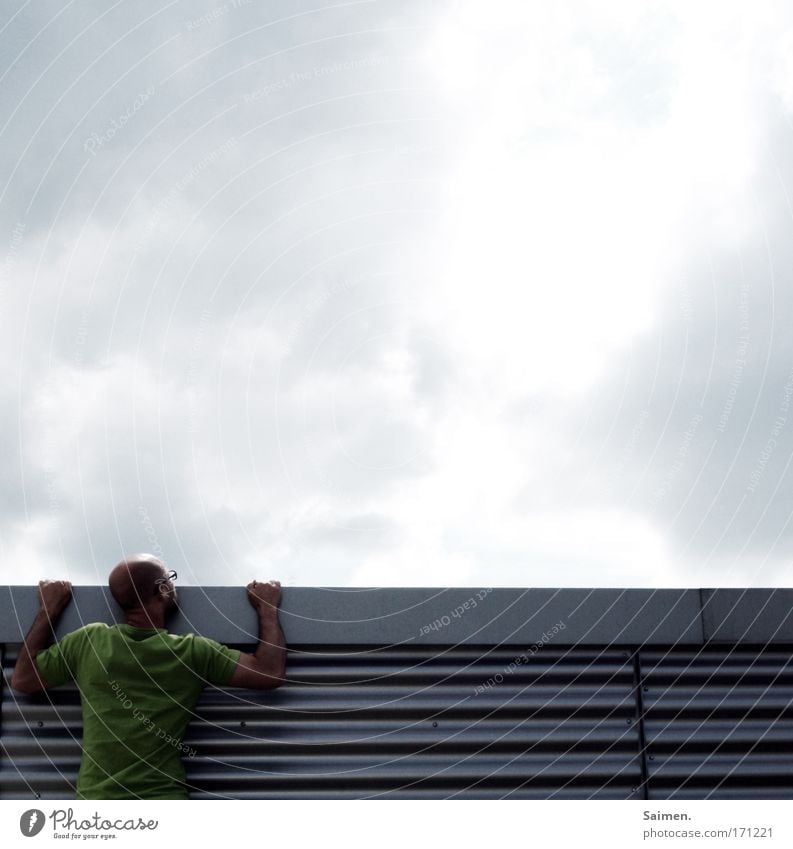 broadening of horizons Colour photo Subdued colour Exterior shot Copy Space top Upper body Looking back Masculine Man Adults Strong Joie de vivre (Vitality)