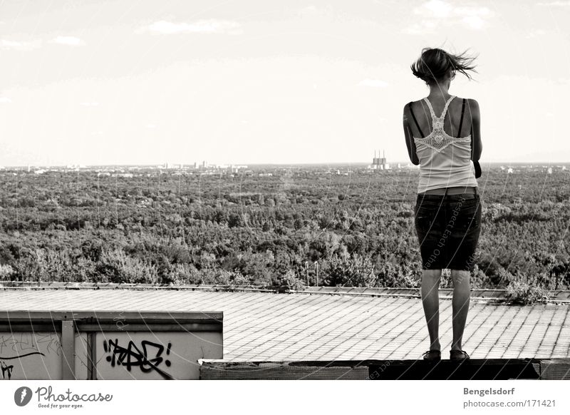 windows Black & white photo Exterior shot Copy Space left Copy Space middle Deep depth of field Full-length Rear view Looking back Feminine 1 Human being Wind