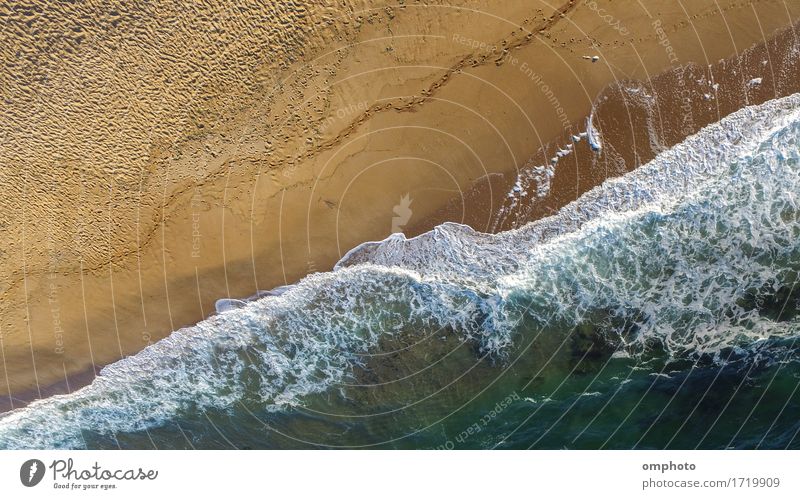 Aerial image of sea waves crashing on a lonely beach in a late summer afternoon Summer Beach Ocean Waves Nature Landscape Sand Weather Storm Coast Movement