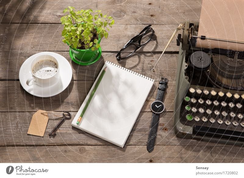 Vintage typewriter on the old wooden desk Coffee Tea Pot Desk Table Workplace Office Newspaper Magazine Book Plant Paper Wood Old Observe Write Retro Green