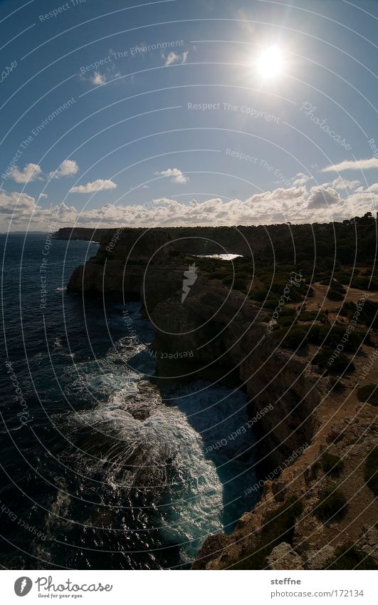 element Subdued colour Exterior shot Aerial photograph Day Sunbeam Back-light Bird's-eye view Landscape Water Sky Clouds Summer Rock Waves Coast Bay Ocean