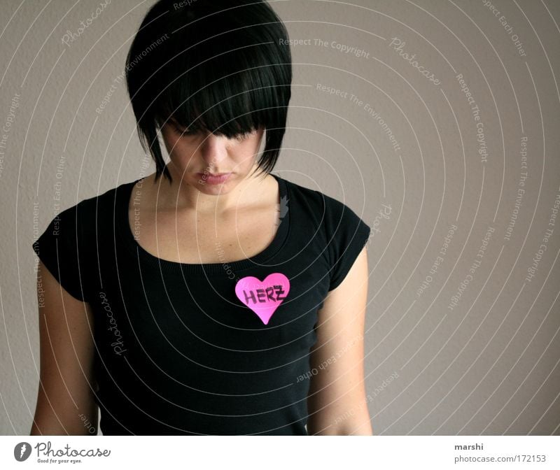 Hearts. Colour photo Human being Feminine Woman Adults Head 1 Stand Emotions Moody Spring fever Passion Safety (feeling of) Love Disappointment Loneliness