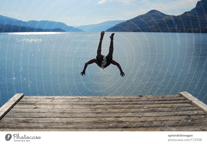 Jump and cool down Colour photo Exterior shot Copy Space left Copy Space right Day Evening Contrast Silhouette Reflection Sunbeam Back-light Deep depth of field