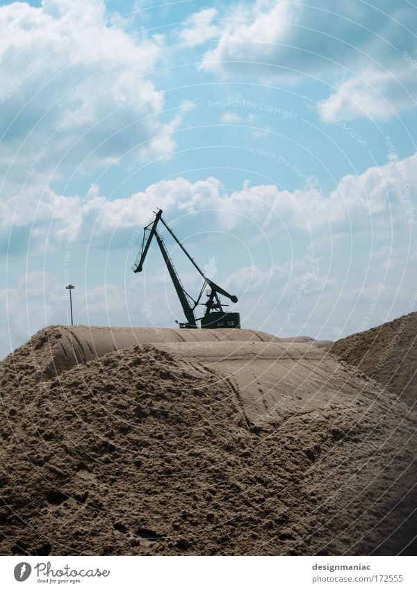 Steel horse in the desert Colour photo Exterior shot Deserted Day Silhouette Back-light Long shot Sand Crane Sky Clouds Machinery Beige Construction site