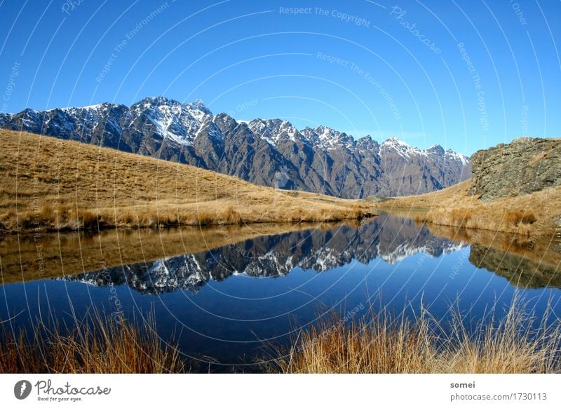 Kelvin Hights Landscape Water Sky Cloudless sky Autumn Beautiful weather Bushes Hill Rock Mountain Snowcapped peak Lakeside Deserted Positive Blue Yellow Gray