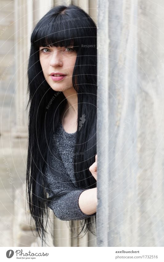 woman peeking out from behind a sandstone pillar Lifestyle Human being Feminine Young woman Youth (Young adults) Woman Adults 1 18 - 30 years Building Window