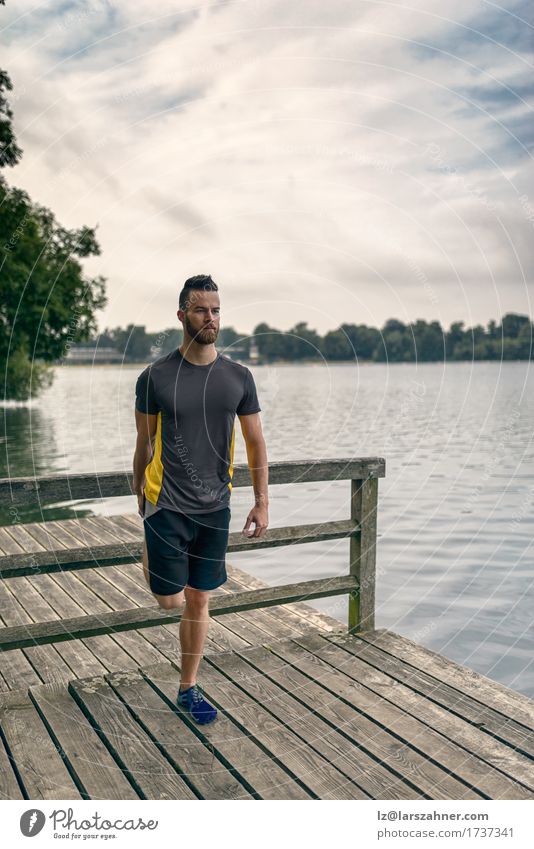 Young man doing stretching exercises Lifestyle Body Face Summer Sports Masculine Man Adults 1 Human being 18 - 30 years Youth (Young adults) Warmth Lake Beard