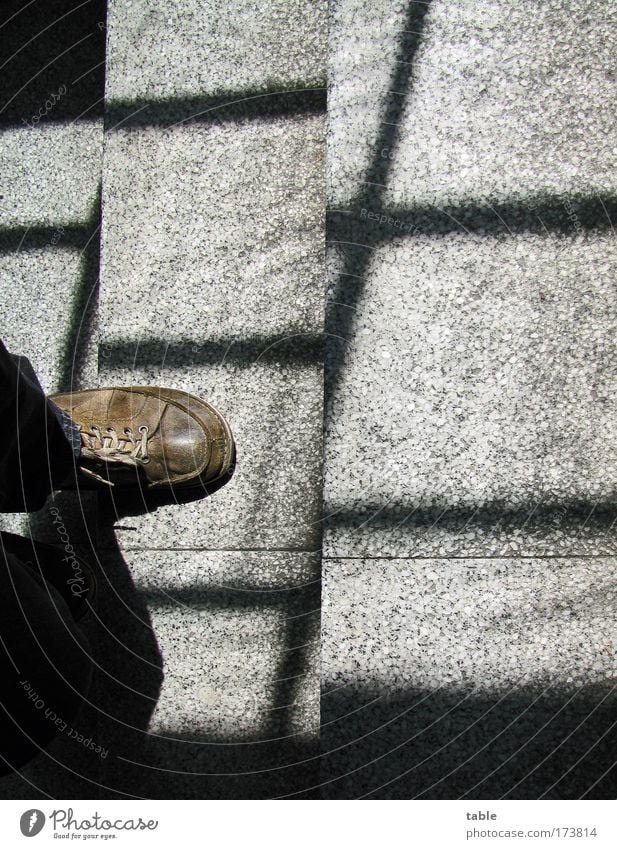 behind bars Colour photo Subdued colour Interior shot Bird's-eye view Man Adults 1 Human being Stairs Pedestrian Leather Footwear Stone Concrete Line Movement