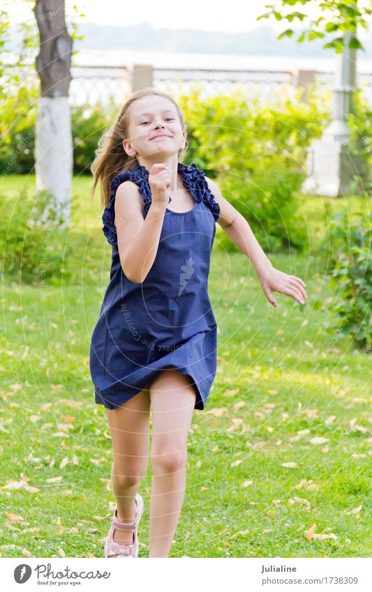 European girl with disheveled hair in green park Lifestyle Leisure and hobbies Playing Summer Child Schoolchild Girl Woman Adults Infancy 3 - 8 years