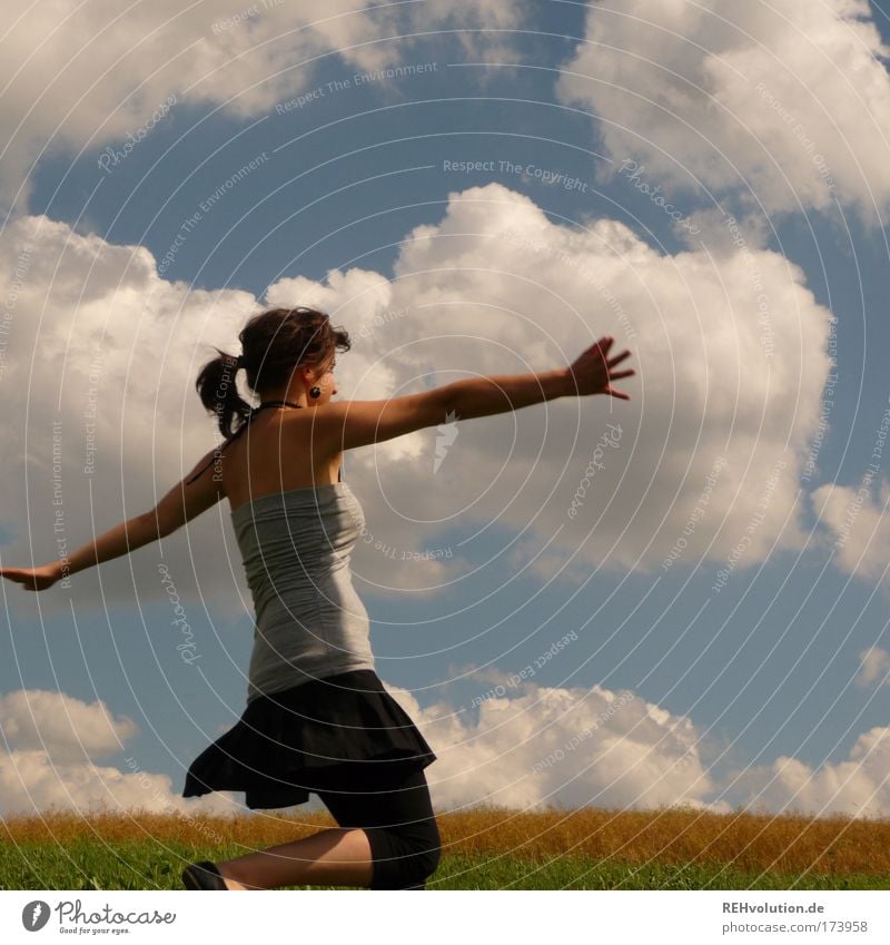 I'm dancing! Colour photo Exterior shot Upper body Feminine Young woman Youth (Young adults) 1 Human being 18 - 30 years Adults Sky Clouds Meadow Skirt Braids