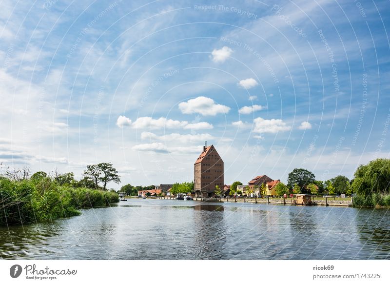 View over the Peene River to the city of Loitz Vacation & Travel Tourism House (Residential Structure) Aquatics Nature Landscape Water Clouds Tree Town Building