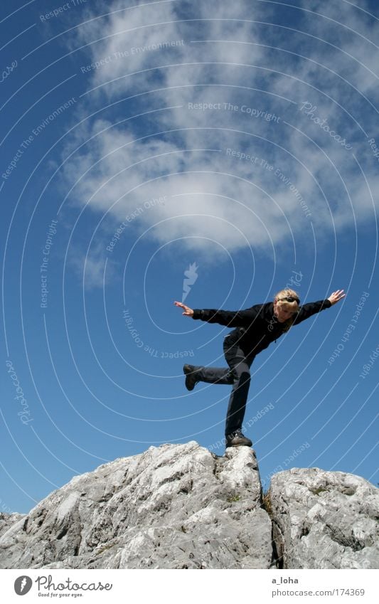 Just don't lose your balance. Colour photo Exterior shot Day Sunlight Worm's-eye view Full-length Downward Adventure Mountain Climbing Mountaineering Hiking Sky