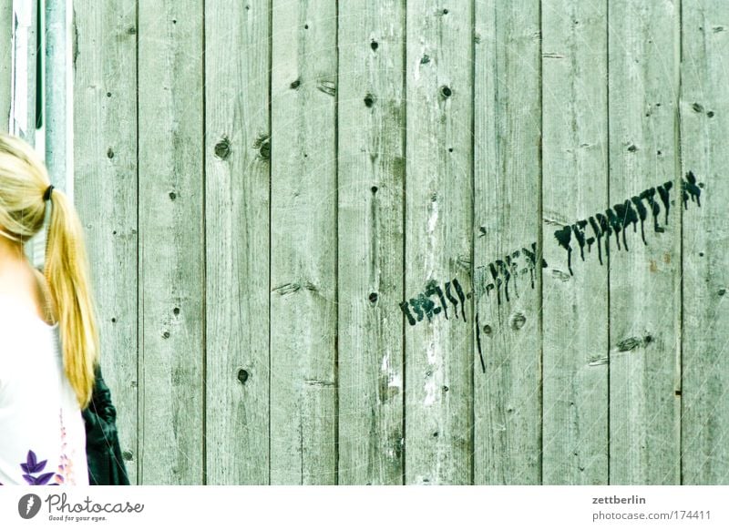 STICK ON FORBIDDEN Construction site Hoarding Fence Wood Wooden board Wooden fence Barrier Bans Rule Guide Assignment Woman Back Hair and hairstyles Ponytail