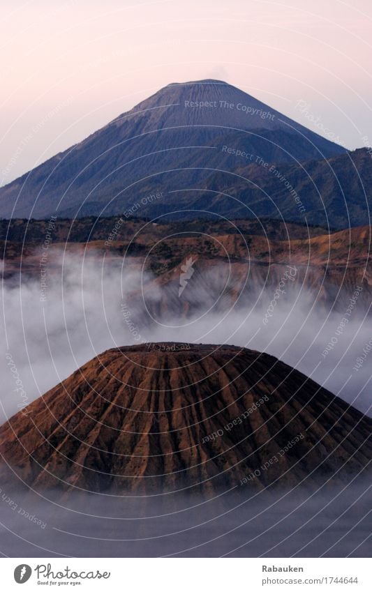 Cloudy Bromo Vacation & Travel Far-off places Mountain Environment Landscape Elements Sky Clouds Beautiful weather Fog Rock Peak Volcano bromo Hiking Threat