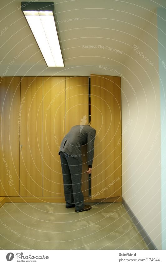 Man in wardrobe Colour photo Interior shot Neutral Background Artificial light Full-length Office work Closing time Masculine Adults 1 Human being Suit Sleep