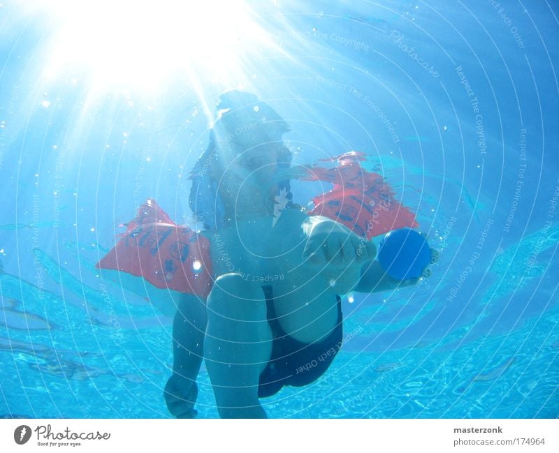 swimming baby Colour photo Multicoloured Exterior shot Underwater photo Light Contrast Sunlight Sunbeam Looking Upward Child Toddler Infancy Chest Arm Hand