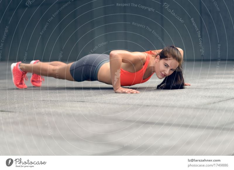 Fit young woman doing push-ups Lifestyle Face Summer Sports Woman Adults 1 Human being 18 - 30 years Youth (Young adults) Small Town Brunette Fitness Thin