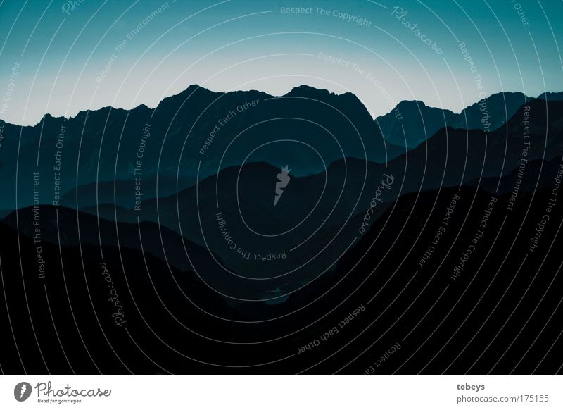 In the dark valley Landscape Diet Mountain Mountain range Peak Blue Alps Valley Climbing Tall Austria Federal State of Tyrol sowing Horizon Colour photo