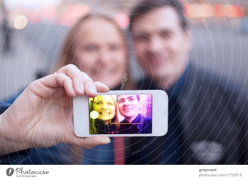 Happy couple smiling taking self portrait on the street Joy Face Telephone PDA Human being Young woman Youth (Young adults) Young man Friendship Couple 2