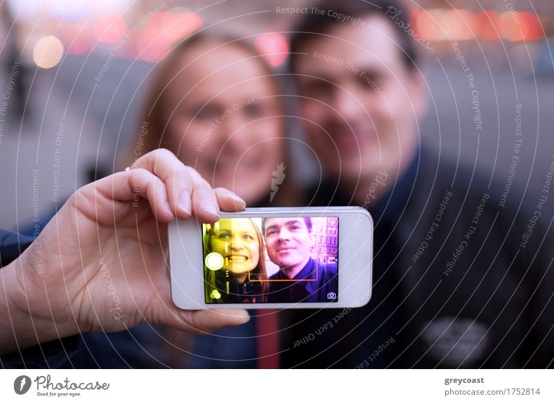 Happy couple smiling taking self portrait on the street Joy Face Telephone PDA Human being Young woman Youth (Young adults) Young man Friendship Couple 2