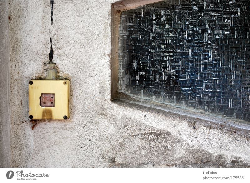 caution current Colour photo Exterior shot Day Wall (barrier) Wall (building) Facade Dirty Retro Trashy Gloomy Gray Loneliness Dangerous Electricity Switch