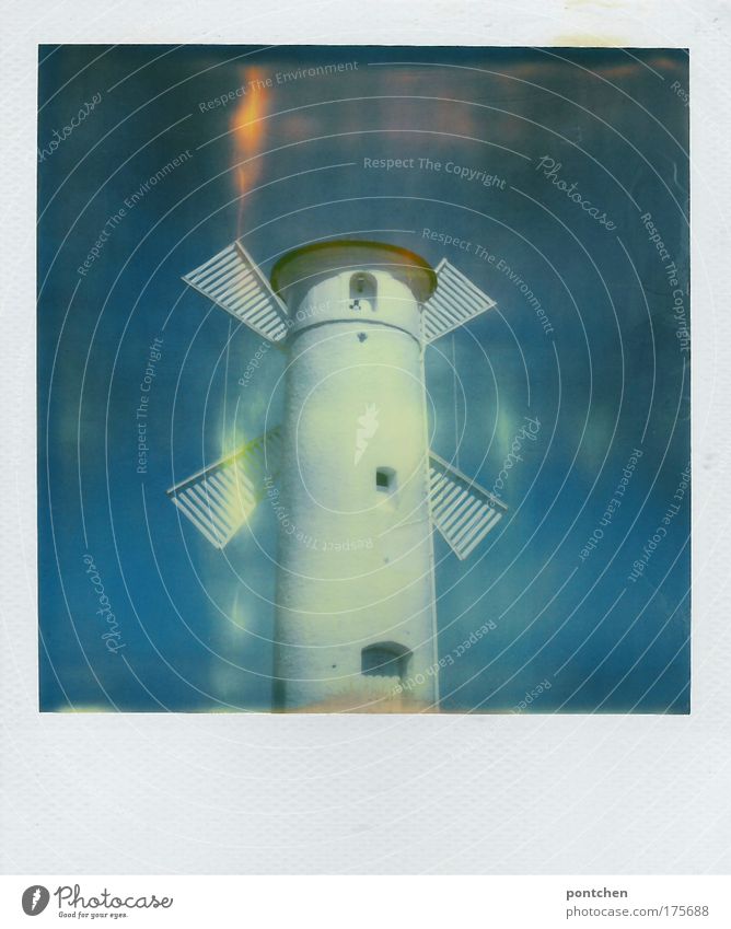 A white windmill against a bright blue sky. Power generation. Sustainability Profession Craftsperson Wind energy plant Industry Village Small Town Port City