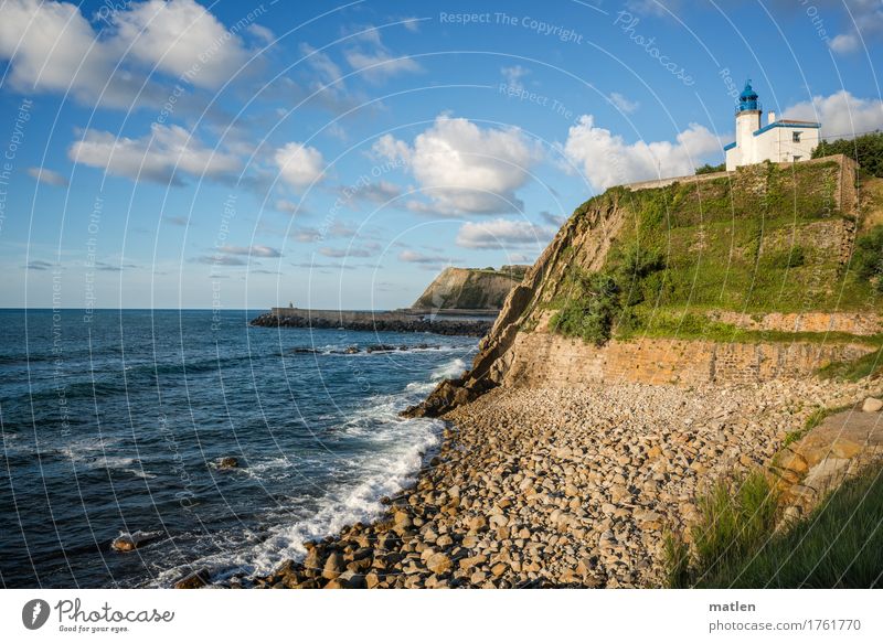 postcard motif Landscape Plant Sky Clouds Horizon Summer Beautiful weather Grass Hill Rock Coast Beach Ocean Blue Brown Green Turquoise White Lighthouse